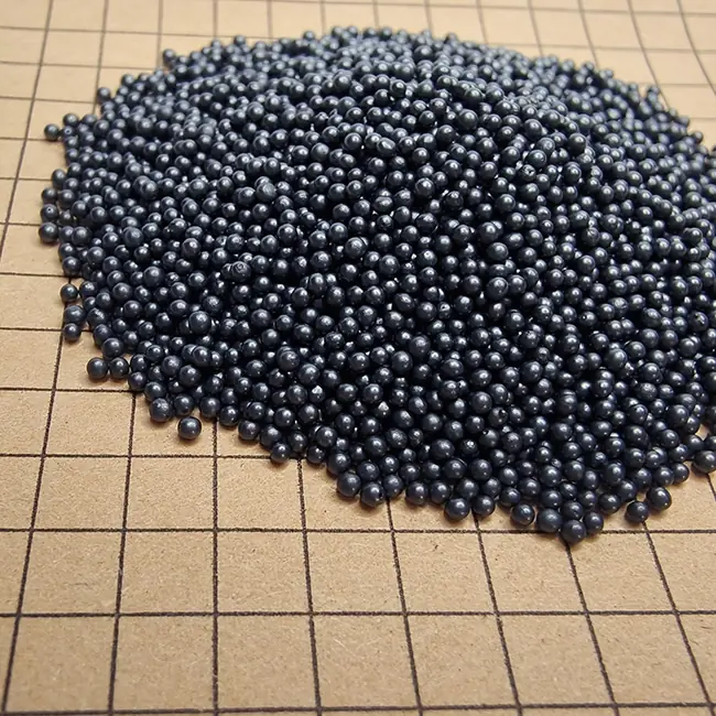 Cast steel shot particles displayed on a grid