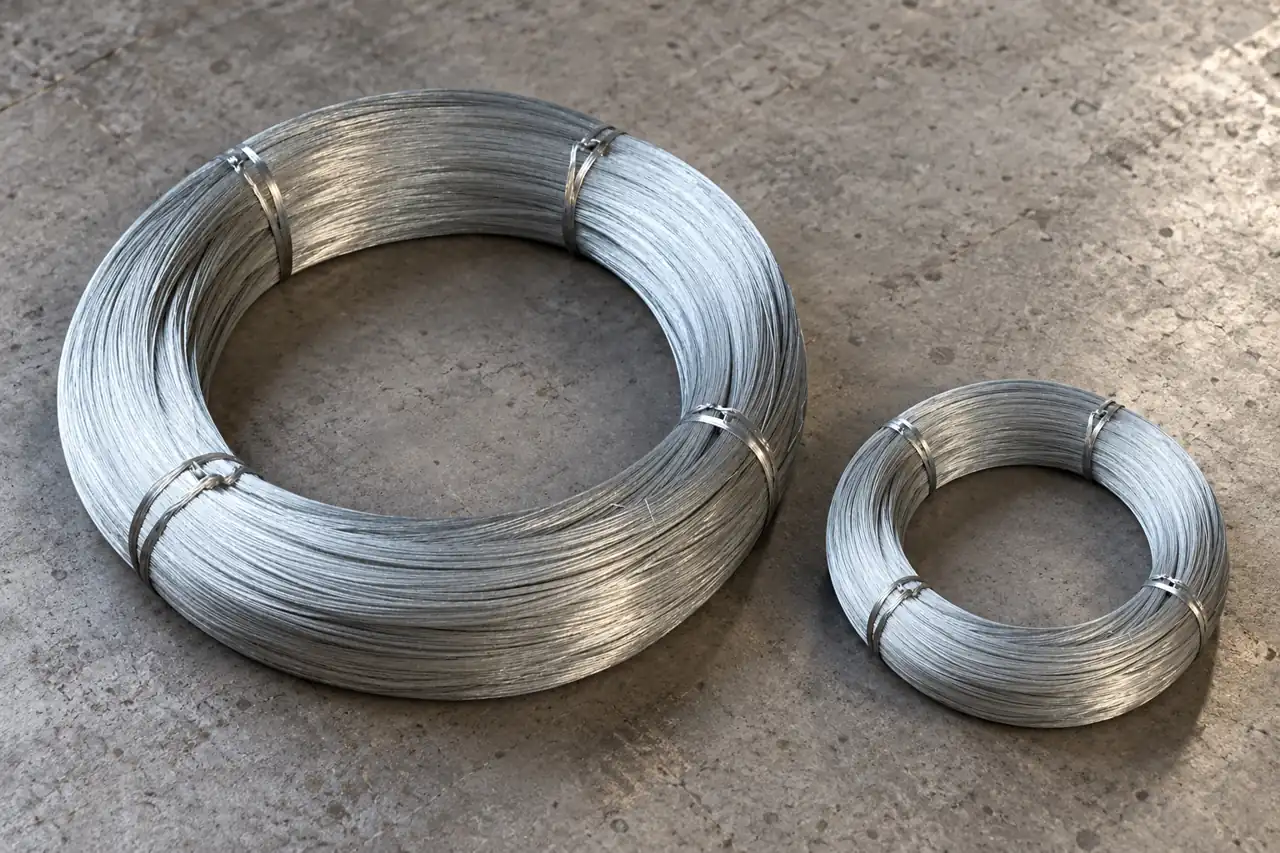 Separate galvanized-wire coils illustrating a multi-size order mix
